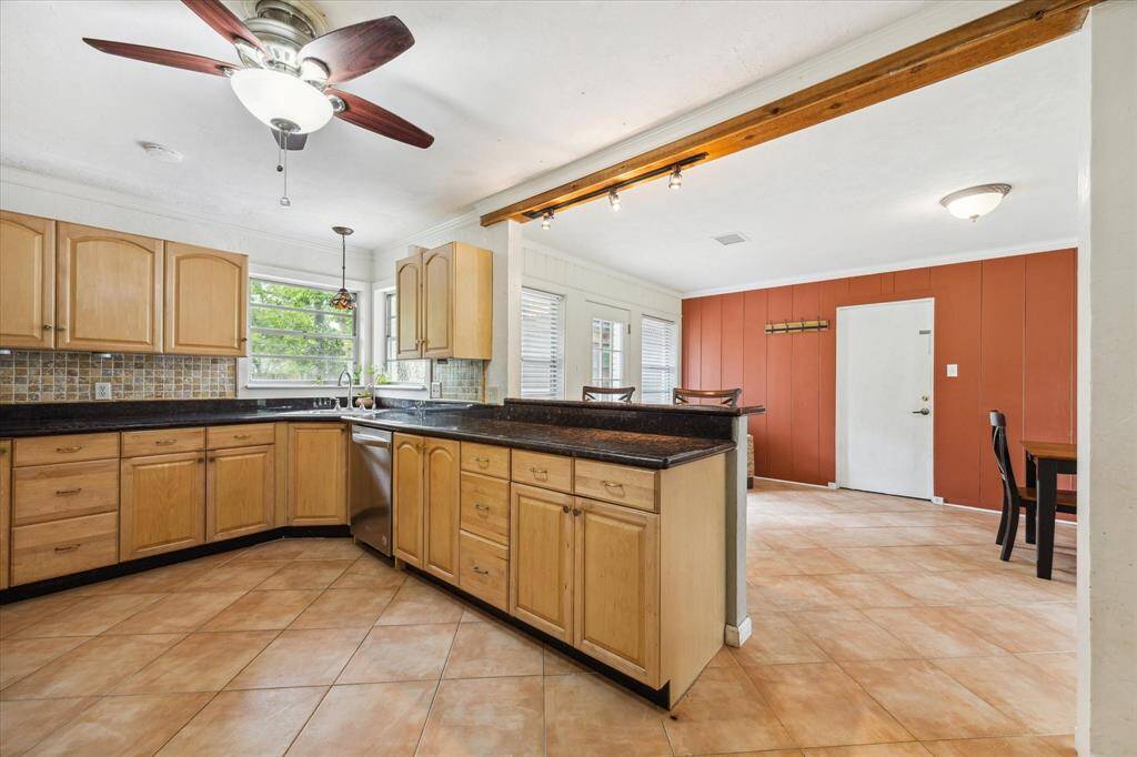 BREAKFAST/DINING ROOMThe kitchen opens out into a dining/sunroom space with access to the backyard and also the garage, where the laundry is located.