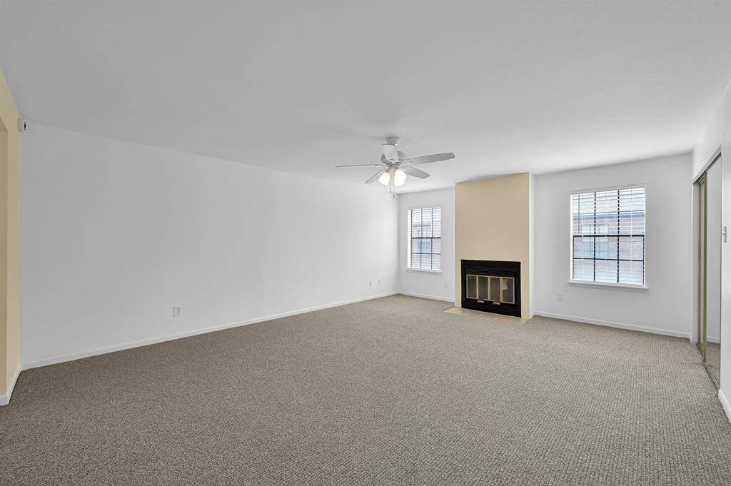 Primary bedroom with Fireplace New carpet.