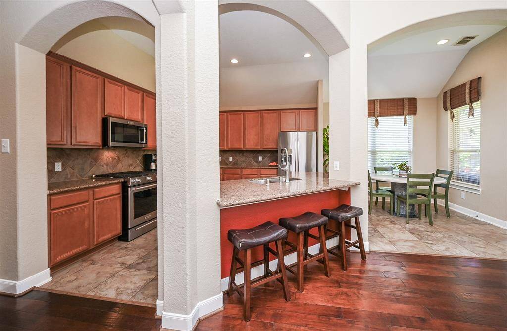 The beauty and versatility of the timeless open floor plan design concept is clearly appreciated here, with the most traveled common areas within footsteps of each other.
