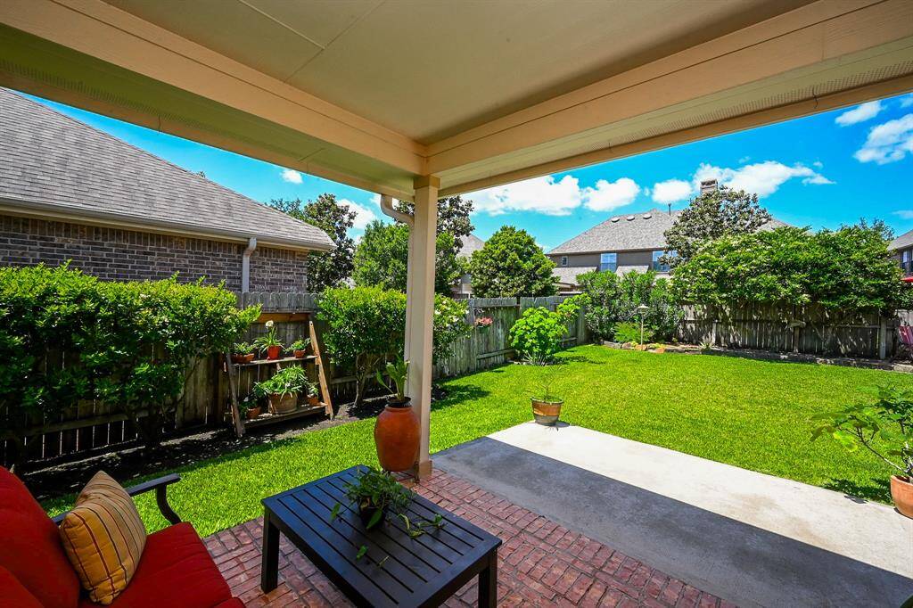 Just sit back and take a deep satisfying breath under your spacious covered patio.