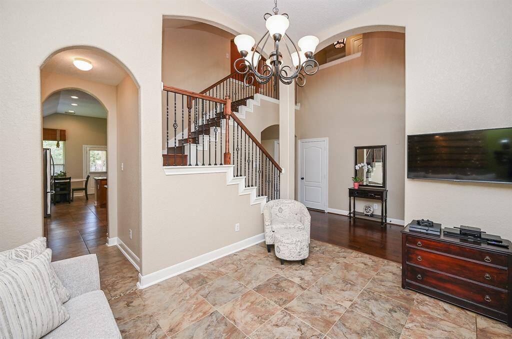 This spacious front room can be just about anything you want it to be, including a lovely sitting room, as suggested here; or a formal dining with beautiful arched doorways, especially the one leading to the chef's kitchen, left.
