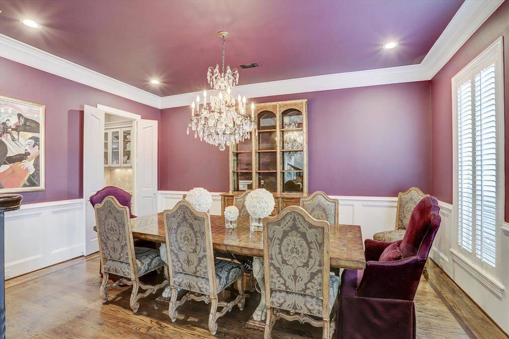 The dining room, which also has hardwood floors, connects to the kitchen through the butler's pantry.