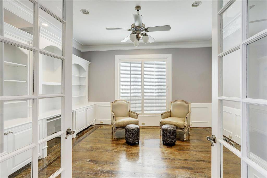 French doors lead to the first floor study, which has a wall of built-ins.