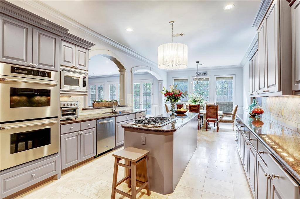 This fabulous kitchen is great for cooking and entertaining! Double ovens, stainless steel appliances, and the sink overlooking the family room.