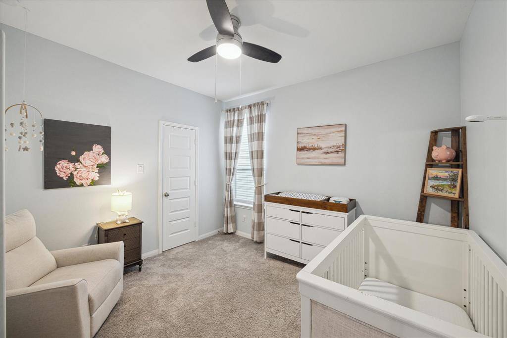 One of two secondary bedrooms upstairs. You will notice every bedroom is ample in size and has fabulous walk-in closets.