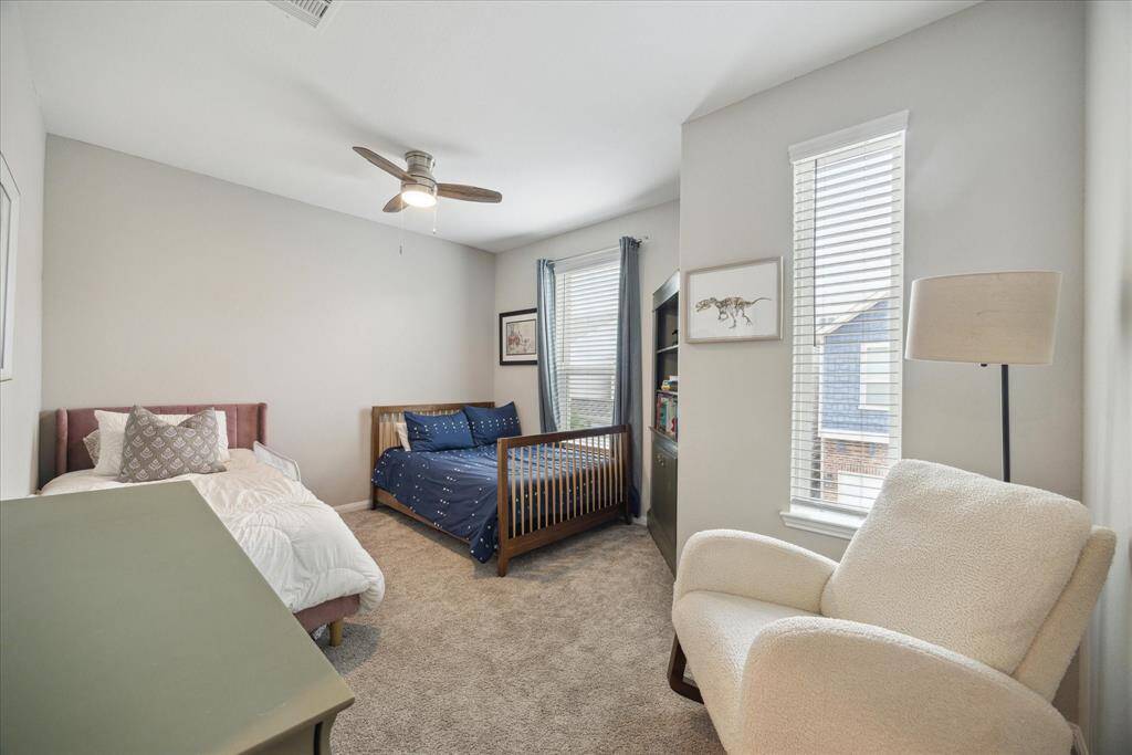 Another spacious bedroom, large enough to fit not just one, but two beds! This room faces north, allowing for an abundance of natural light to fill the space, creating a bright and airy atmosphere.