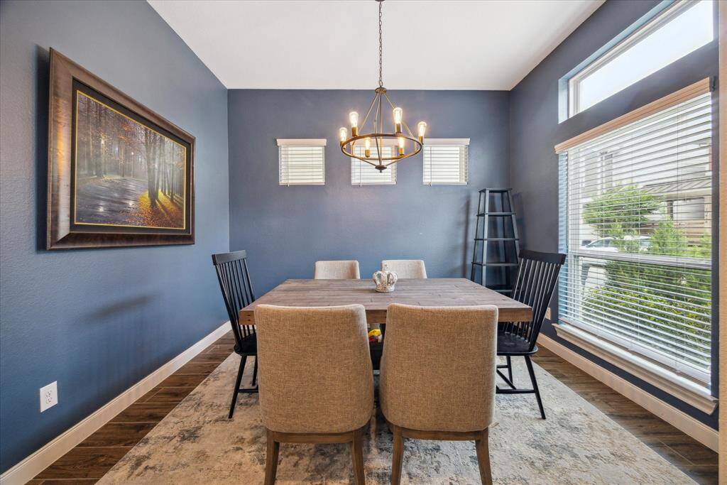 A warm and inviting dining room filled with natural light, creating the perfect space for family meals and gatherings.