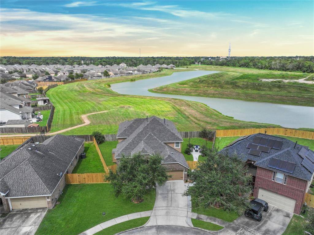 Welcome to 1078 Lasso Court in Alvin's Mustang Crossing neighborhood! This 2012-constructed brick and Hardie Plank two-story home with attractive landscaping is situated on a desirable cul-de-sac lot with a wide open greenspace behind it.
