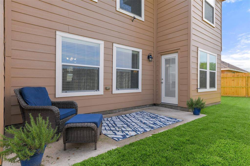The full panel glass door located in the breakfast room leads out to this quaint concrete patio area overlooking a large yard with private gate access to the pond & greenspace behind the home...but that is just a taste of what this backyard has to offer!