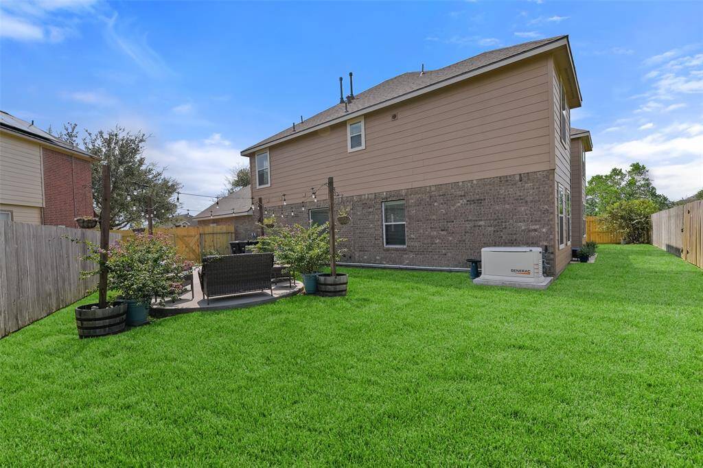 Meander around to the east side of the backyard and there is a lovely patio area that beckons gathering for treasured family and friends. Also, note that there is a 24kW whole home gas generator that is just one year old!