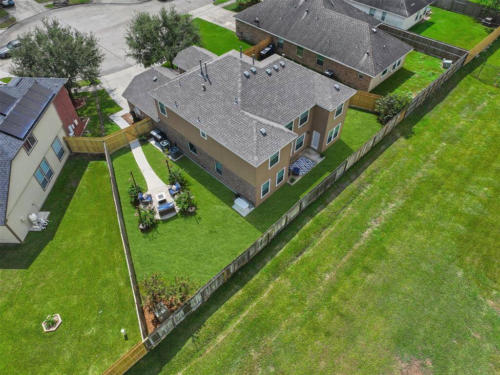 One last look at 1078 Lasso Court from an aerial perspective highlights the impressively sized footprint of the home as well as the desirable location on a cul-de-sac lot, the ample yard space, and the ultimate privacy with no rear neighbors.