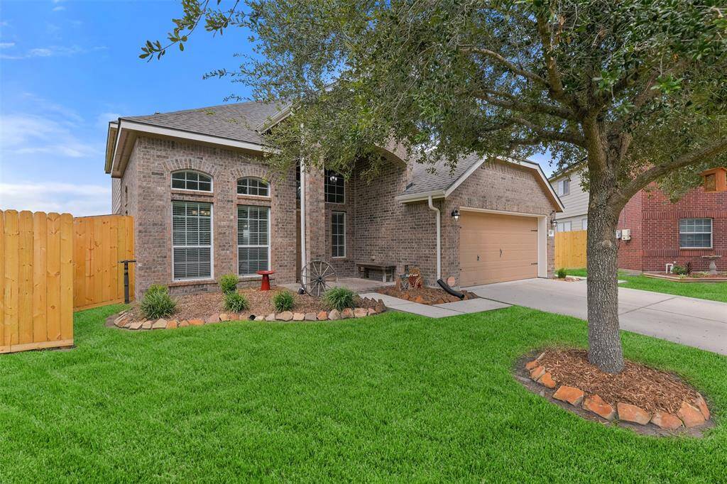 Welcome to 1078 Lasso Court in Alvin's Mustang Crossing neighborhood! This 2012-constructed brick and Hardie Plank two-story home with attractive landscaping is situated on a desirable cul-de-sac lot with a wide open greenspace behind it.