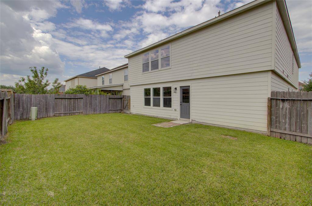 The backyard is huge.  The perfect space for a pool, playground, backyard cookout and more!