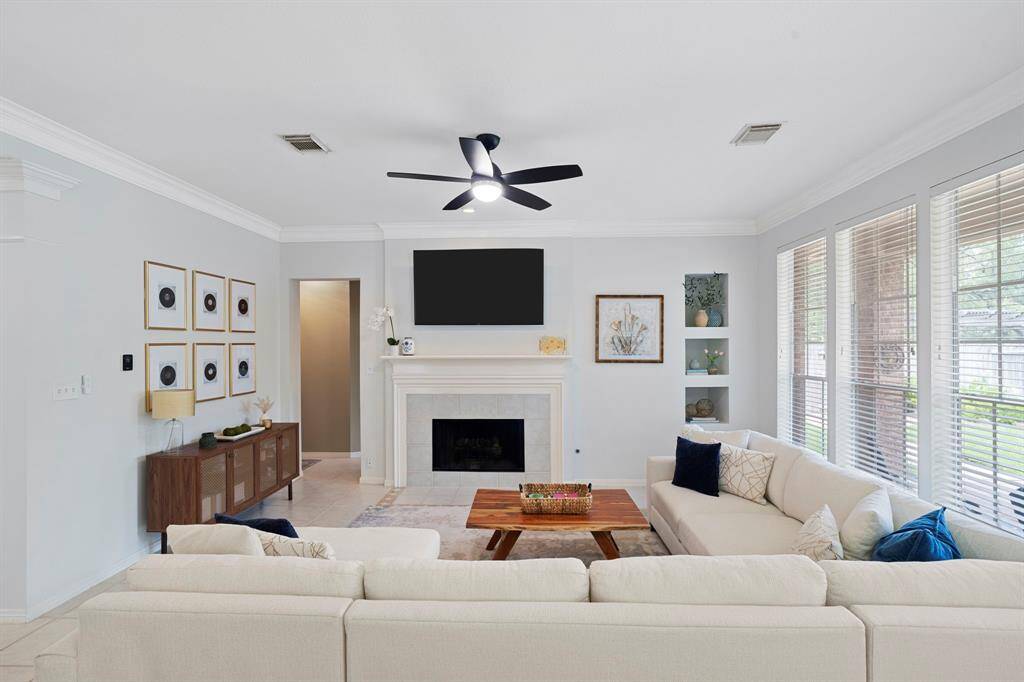 At the heart of the space, a fireplaceadds a cozy focal point, providingwarmth and charm.