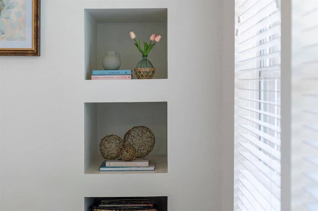 The living room features built-in storage nooks.
