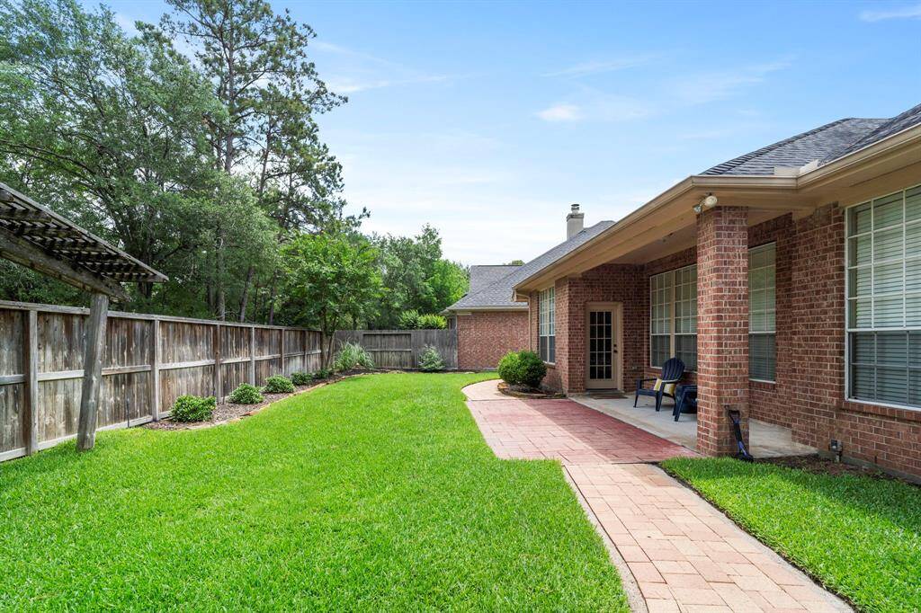 Step into the backyard oasis, with a covered patio, creating aninviting outdoor retreat.
