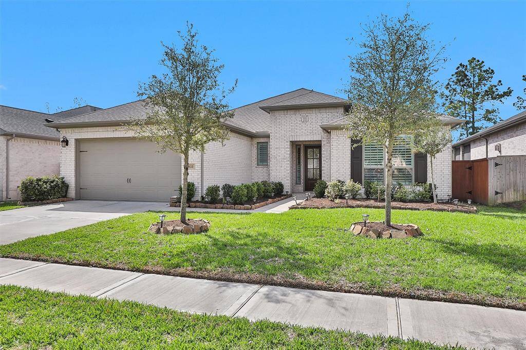 A welcoming view of the home's elegant exterior with well-maintained landscaping, showcasing its impressive curb appeal.