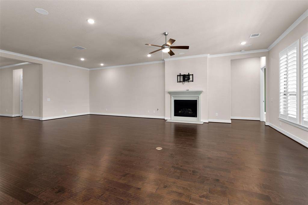 A spacious living area with abundant natural light, perfect for relaxing or entertaining guests.