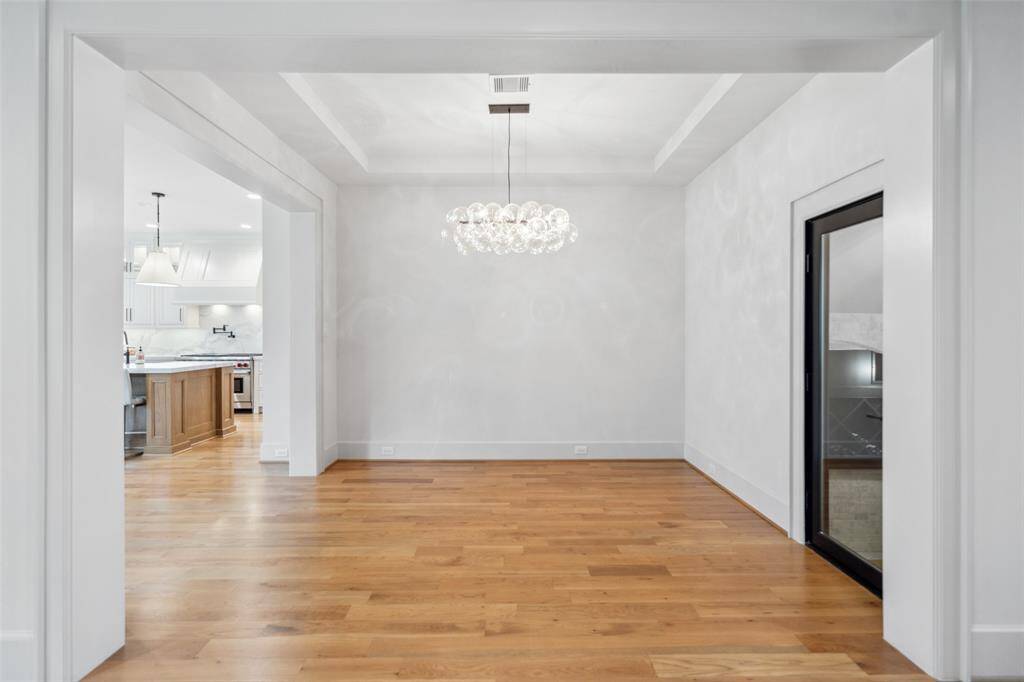 The Formal Dining Room offers an great space for large dinner parties w/ access to below-ground temp controlled wine room.