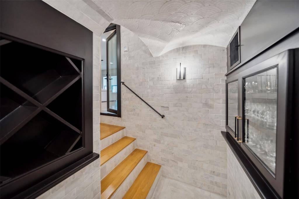 Step down into your secluded wine room.