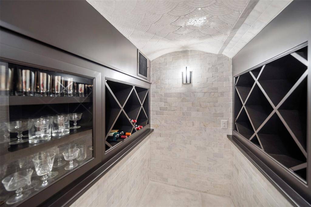 Temperature controlled wine room offers storage for your wine collection.