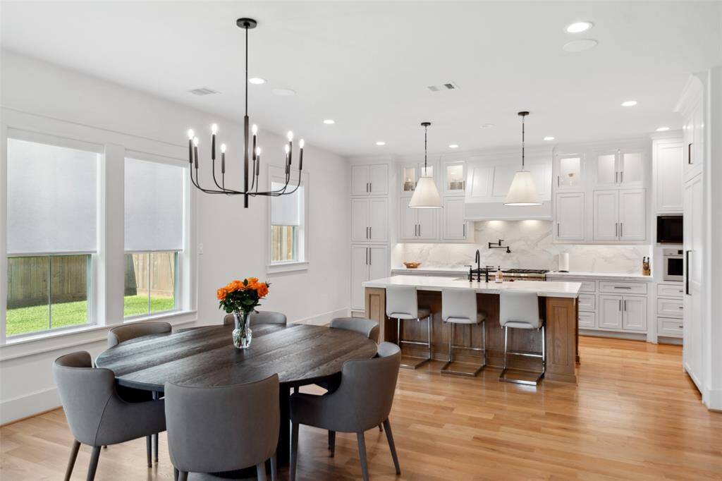 Breakfast & Chef's Kitchen offer a grand place to entertain. Chef's Kitchen offers a large island 2/ quartz counters, cabinets to the ceiling w/ glass fronts, pot/pan drawers, pot filler, Panel-front Refrigerator, 48" Wolf Range, Bosch Coffee Maker & Designer pendant lighting.