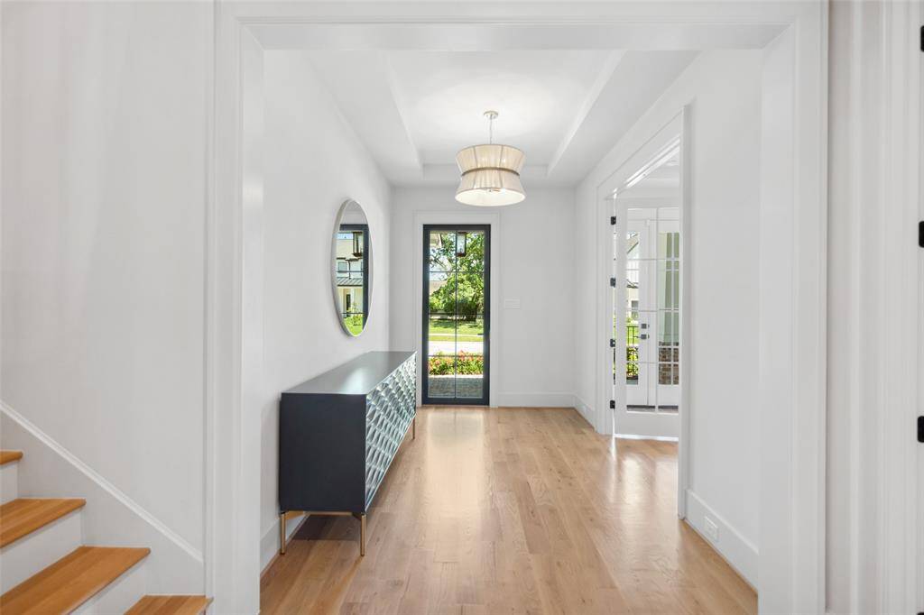 Stairs tucked away off the front entry.