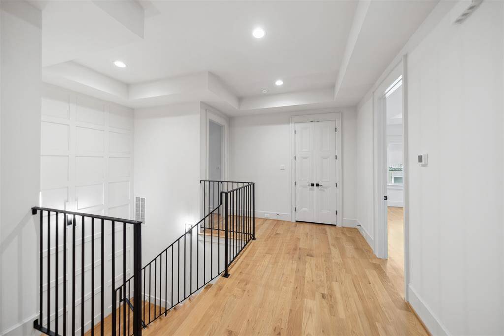 Enter the 2nd Floor - notice the paneled stairway and wood floors throughout the entire second floor.