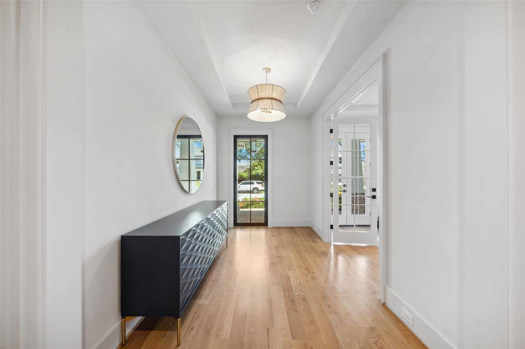 Formal entryway with private home office.