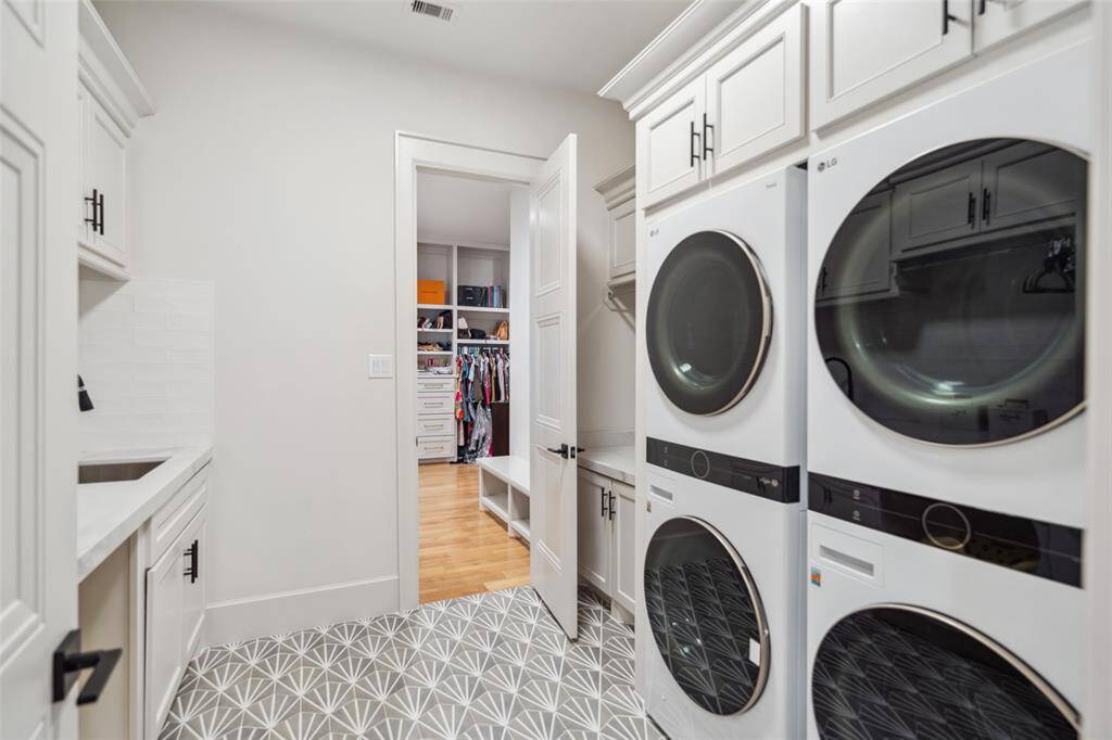 Direct flow from Primary Closet to Laundry Room.