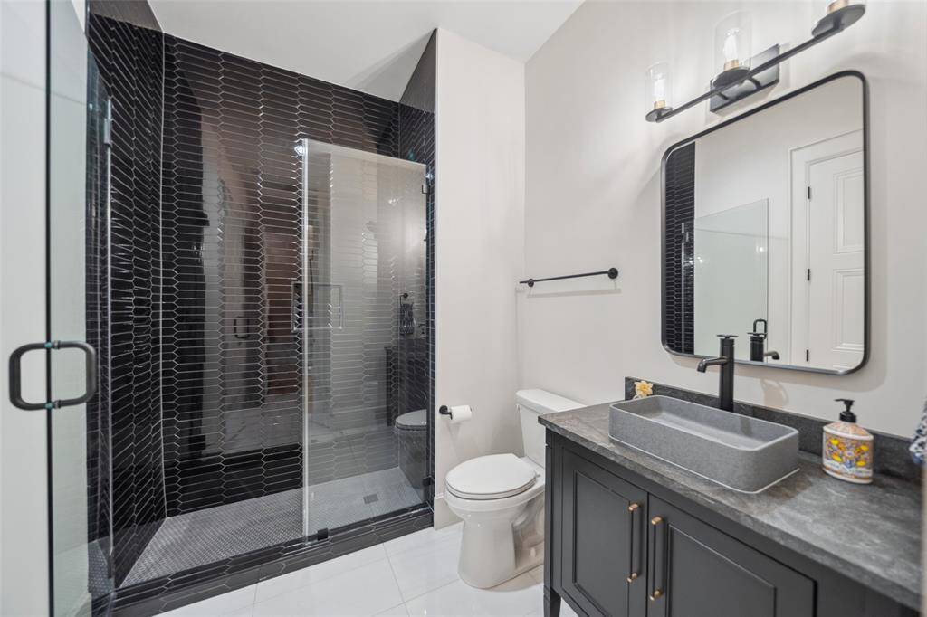 Full Bath downstairs w/ dual entry from Study & Hallway for guests.