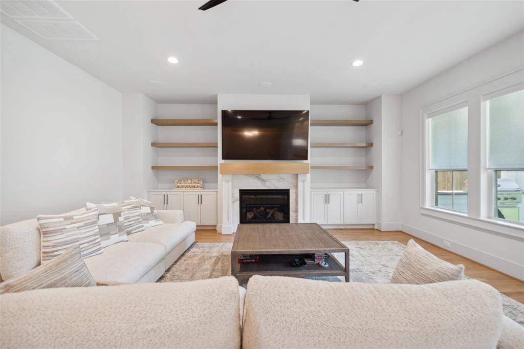 Over-sized area allows for large furniture & offers custom site-built cabinetry built-ins & floating shelves.