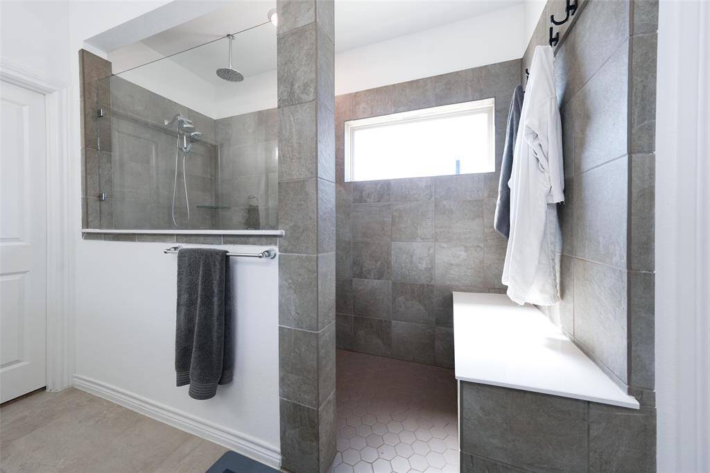 Indulge in the ultimate shower experience with dual shower heads in the spacious primary bath.