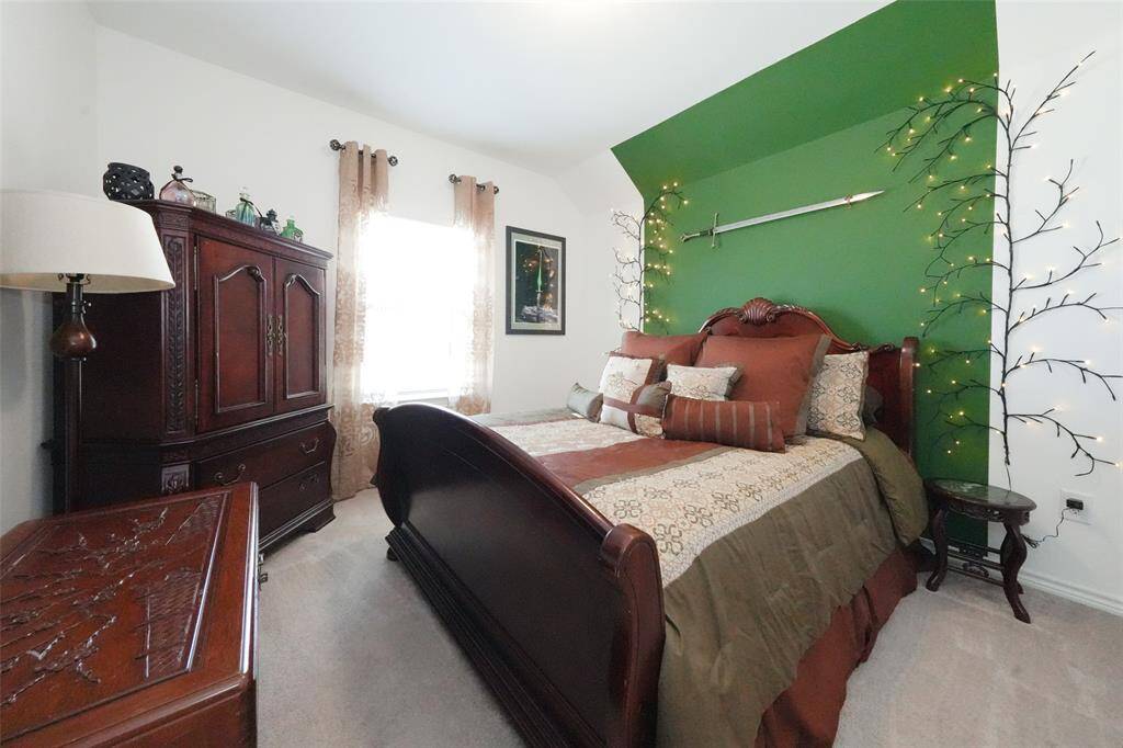 Ensuite guestroom featuring a lovely street view and walk-in closet, offering a perfect retreat for your guests.