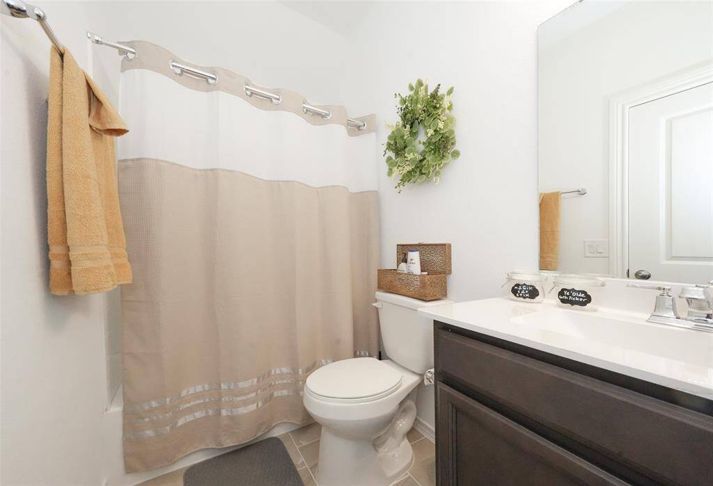 A well-appointed ensuite bathroom connected to the guest room, perfect for guests seeking comfort and privacy.