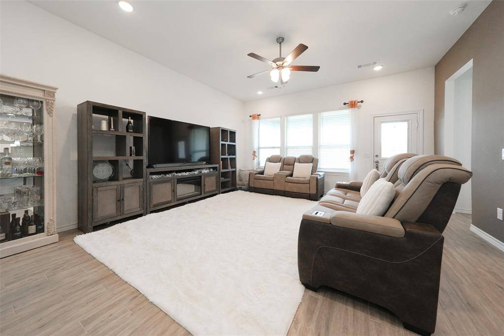 Spacious living area overlooks the stunning backyard—perfect for relaxing or entertaining.