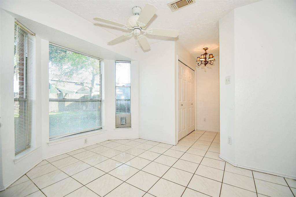 Breakfast nook adjacent to the kitchen and laundry area