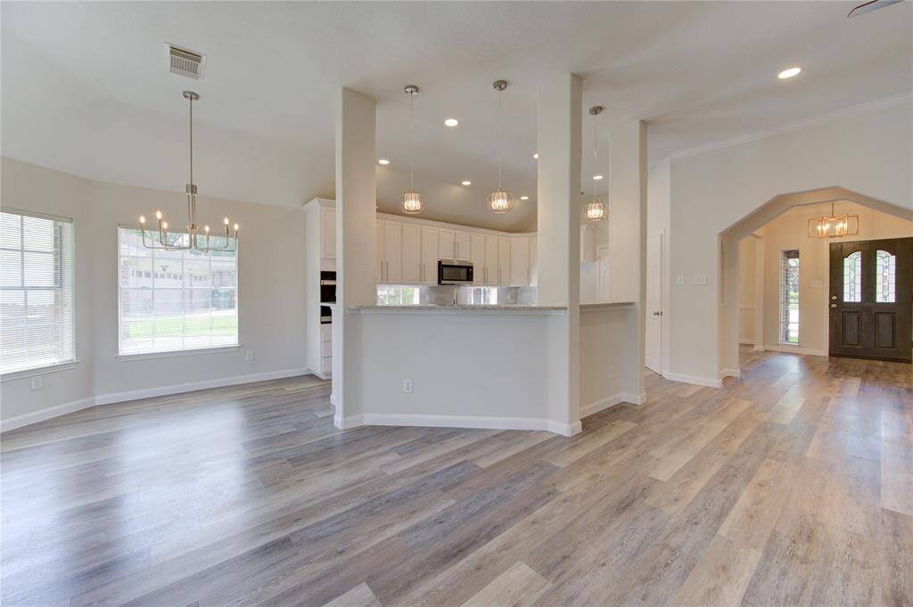 The kitchen has 2 sit up bar areas with stylish new pendant lighting above.