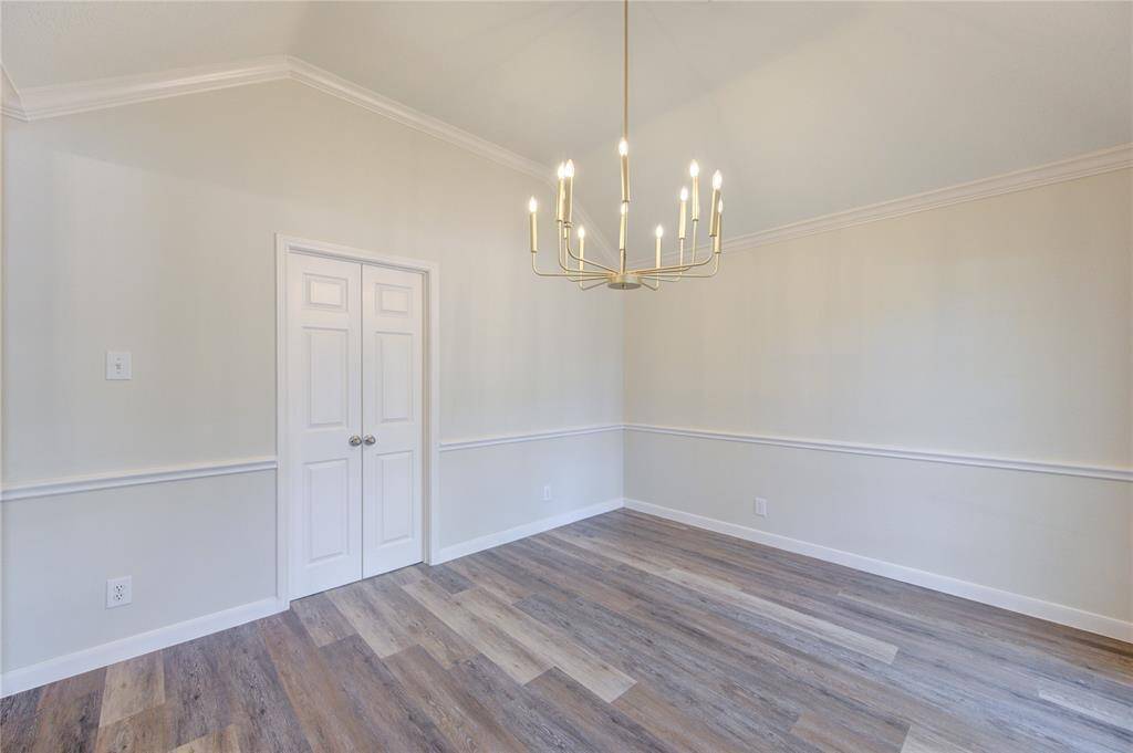 Formal dining room with double doors to the kitchen