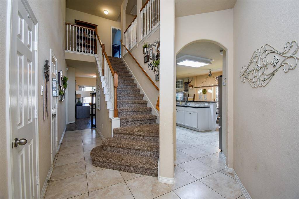Down the hall to the right, enterthe kitchen, and to the left, acloset and half bath.
