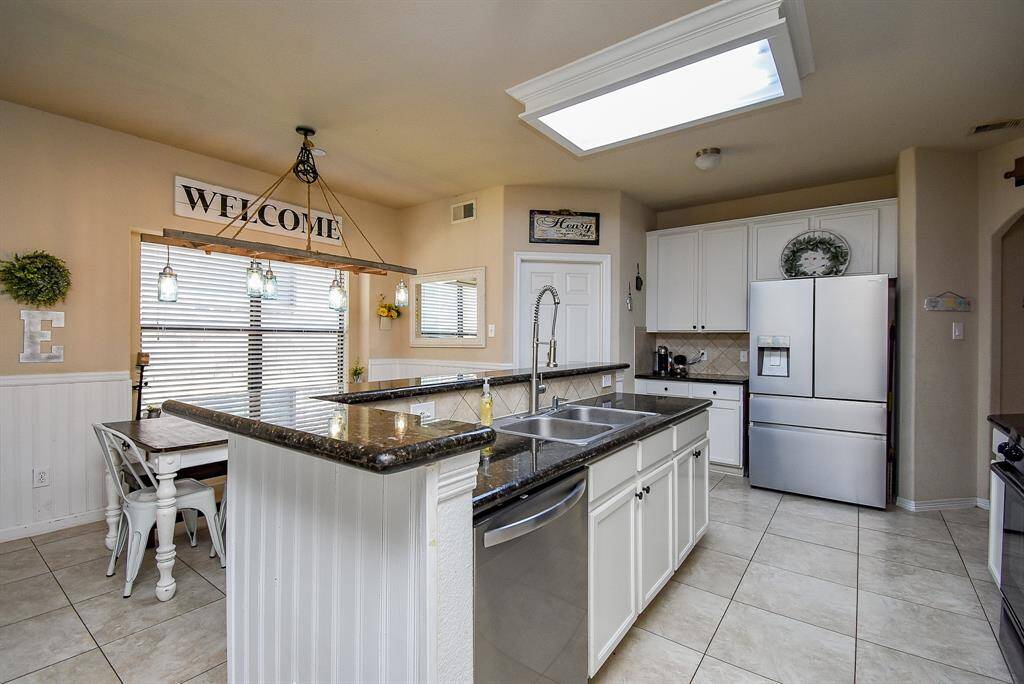 Kitchen with gas range andplenty of cabinet space. Refrigerator not included.