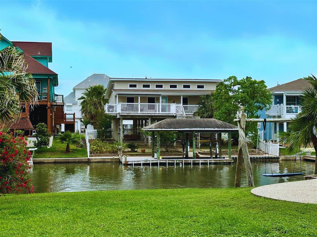 Waterfront home on canal that connects to the Bay, complete with boathouse