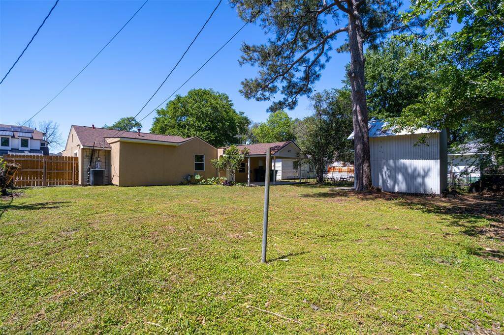 Take a look at this yard- super spacious and has a covered patio and storage shed.