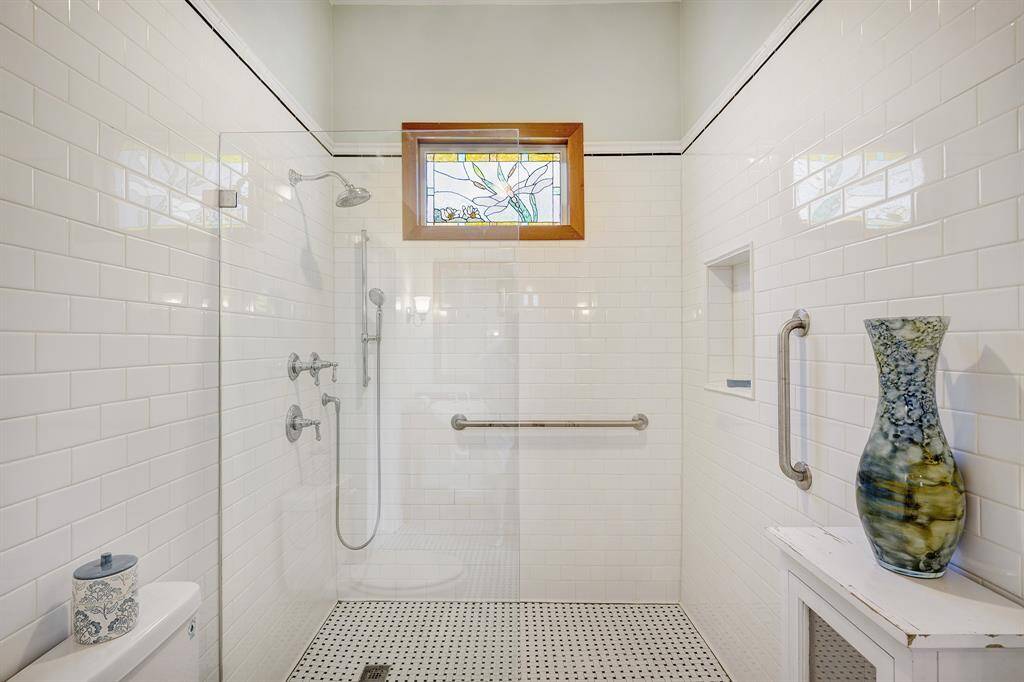 Murphy bath with walk-in shower between two downstairs bedrooms.