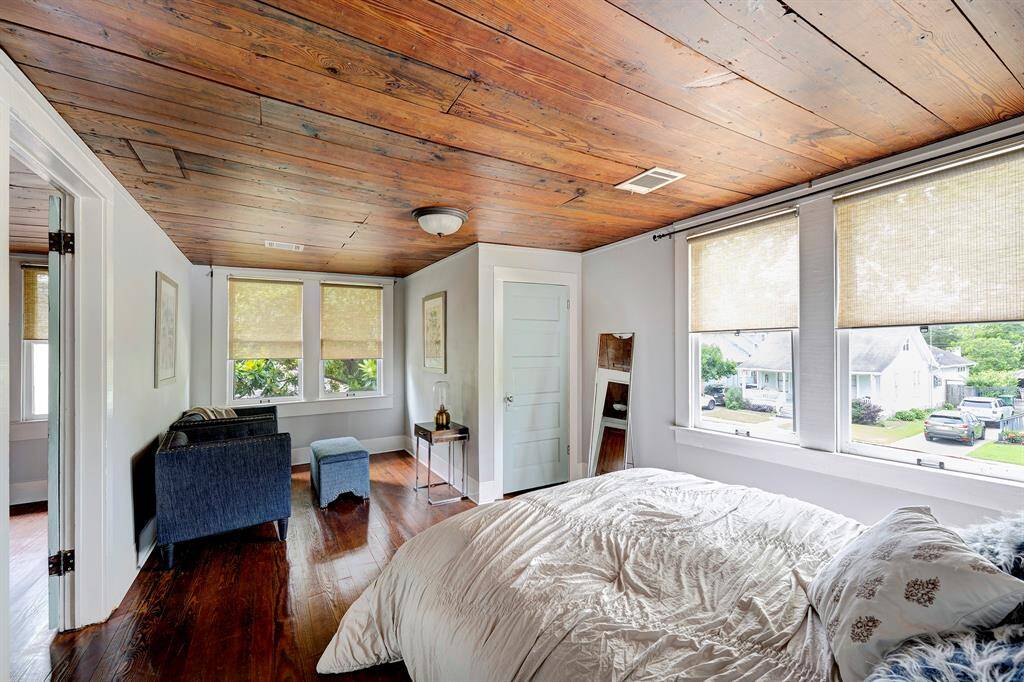 Primary bedroom with seating area.