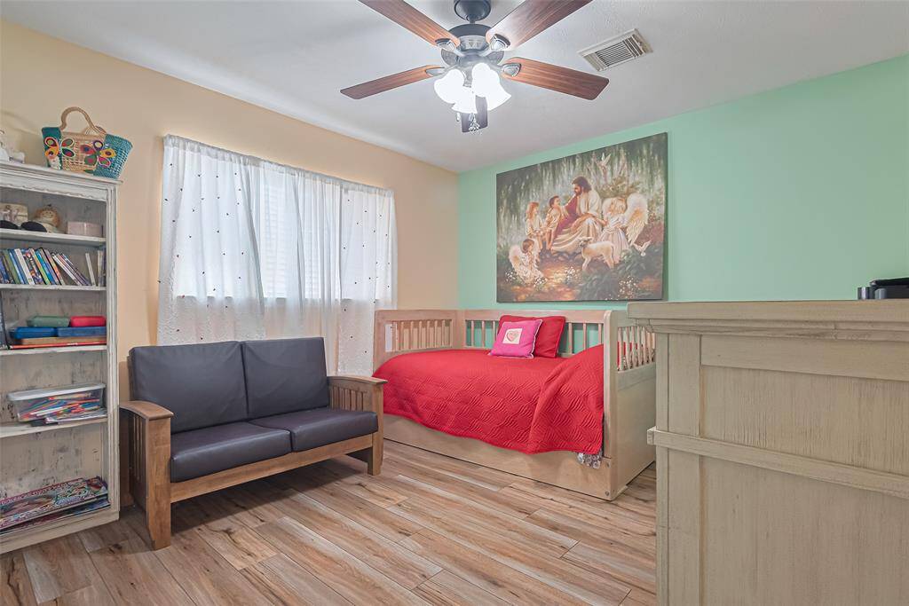 Bedroom 3 with window to back yard