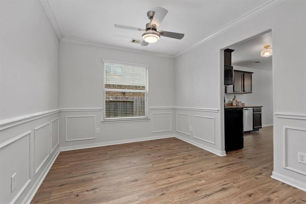 Dining room with kitchen access for effortless entertaining.