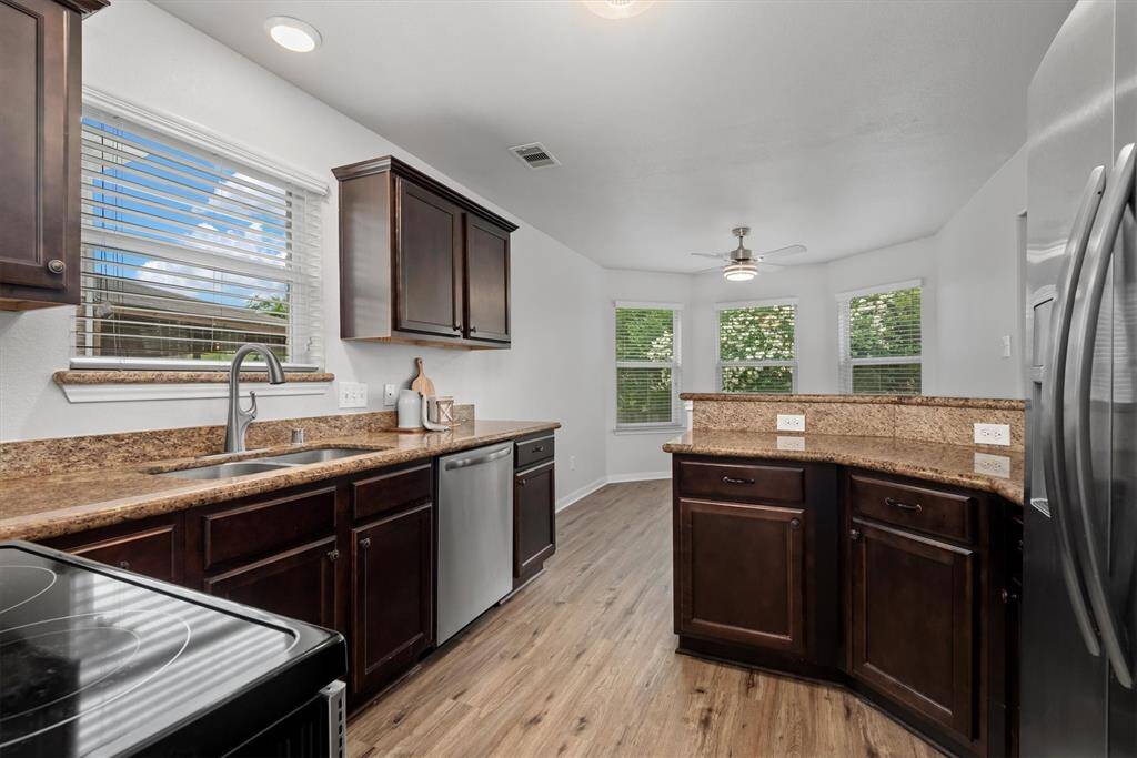Lovely kitchen with picturesque window at the kitchen sink.