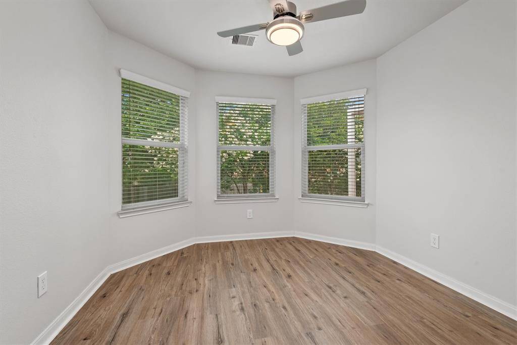 Charming bay windows enhance this inviting breakfast room.