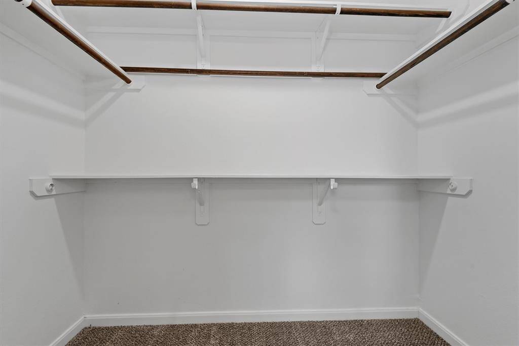 Generous walk-in closet enhances the owner’s suite.